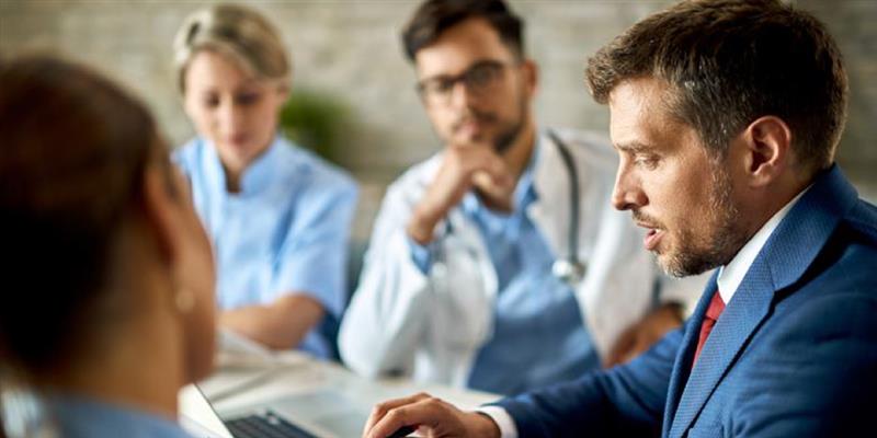 Attorneys reviewing AI-organized medical records for mass tort litigation case preparation